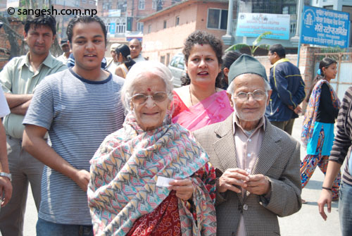 Elderly couple arrive to cast vote - Constituent Assembly election